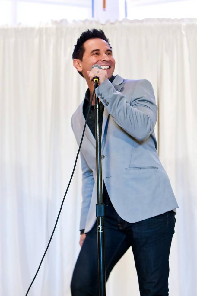 Travis Cloer, of the Jersey Boys, performs Let the Good Times Roll during a fundraiser to benefit trombonist Mike Turnbull, who is recovering from stage-four thyroid cancer, at New Song Anthem Church Saturday, May 11, 2013.